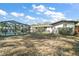 View of the backyard with an enclosed pool area and a shed at 24450 Ne 127Th St, Salt Springs, FL 32134