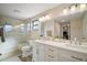 Bathroom featuring a large double sink vanity, glass-enclosed shower, and modern lighting at 24450 Ne 127Th St, Salt Springs, FL 32134