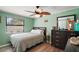 Bedroom showcasing a window with blinds and a dresser at 24450 Ne 127Th St, Salt Springs, FL 32134