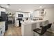 Well-lit kitchen featuring white cabinets and modern appliances at 24450 Ne 127Th St, Salt Springs, FL 32134