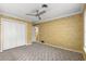 Bedroom with double door closet and neutral carpeting at 2450 Topping Pl, Eustis, FL 32726