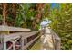 Wooden walkway to private dock with gazebo at 2450 Topping Pl, Eustis, FL 32726