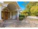 Front entry with arched stone walkway and double doors at 2450 Topping Pl, Eustis, FL 32726