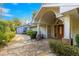 Home entrance with stone walkway and double wood doors at 2450 Topping Pl, Eustis, FL 32726