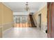 Bright foyer with tile floors and a grand staircase at 2450 Topping Pl, Eustis, FL 32726