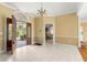 Open foyer with view of kitchen and staircase at 2450 Topping Pl, Eustis, FL 32726