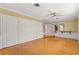 Large living room with hardwood floors and built-in storage at 2450 Topping Pl, Eustis, FL 32726