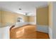 Light-filled living room with hardwood floors, a ceiling fan, and an arched window at 2450 Topping Pl, Eustis, FL 32726