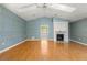 Main bedroom with vaulted ceiling, fireplace and access to a private balcony at 2450 Topping Pl, Eustis, FL 32726