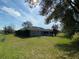 Spacious backyard with a basketball hoop and plenty of grassy area at 2613 Crest Dr, Haines City, FL 33844