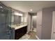 Modern bathroom featuring a single vanity, shower, and updated fixtures at 2613 Crest Dr, Haines City, FL 33844