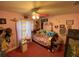 Charming bedroom featuring a twin bed, colorful decor, and a ceiling fan at 2613 Crest Dr, Haines City, FL 33844