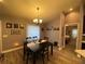 Bright dining room with a wooden table and chairs, near a bedroom at 2613 Crest Dr, Haines City, FL 33844