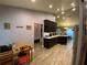 View of the kitchen from the dining area, showing the breakfast bar and appliances at 2613 Crest Dr, Haines City, FL 33844