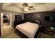 Main bedroom with a king-size bed and view into the dining area at 2613 Crest Dr, Haines City, FL 33844