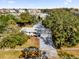 Aerial view of a single-story home with mature trees at 2667 Northland Rd, Mount Dora, FL 32757