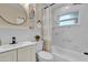 Updated bathroom featuring tile surround tub, new fixtures, and a modern vanity at 2667 Northland Rd, Mount Dora, FL 32757