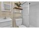 Bathroom featuring tiled walls, vanity, toilet, shelving, and a glass shower stall at 2667 Northland Rd, Mount Dora, FL 32757