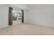 Bright bedroom featuring a ceiling fan and large windows, providing ample natural light at 284 Pelchat Pl, The Villages, FL 32163