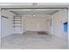 Interior view of a 2 car garage with door opened at 284 Pelchat Pl, The Villages, FL 32163