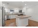 Well-lit kitchen featuring white cabinetry, stainless steel appliances, and a peninsula with bar seating at 284 Pelchat Pl, The Villages, FL 32163