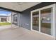 Screened porch with ceiling fan, outdoor living space, and view of the backyard at 284 Pelchat Pl, The Villages, FL 32163