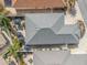 Overhead view showcasing the home's roofline and backyard patio area at 2987 Schoenacher St, The Villages, FL 32163