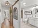 Clean bathroom with white cabinets, a shower/tub combo and barn door at 2987 Schoenacher St, The Villages, FL 32163