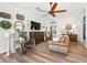 Bright living room with hardwood floors and farmhouse decor at 2987 Schoenacher St, The Villages, FL 32163