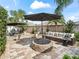 Relaxing patio with fire pit and comfortable seating at 2987 Schoenacher St, The Villages, FL 32163