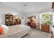 Bedroom with large window providing natural light at 3001 Saint Thomas Ln, The Villages, FL 32162