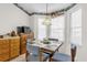 Cozy kitchen nook with a table, chairs, and bay windows with natural lighting at 3001 Saint Thomas Ln, The Villages, FL 32162