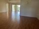 Spacious living room with sliding glass doors leading to screened outdoor space at 3001 Saint Thomas Ln, The Villages, FL 32162