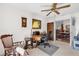 Bright home office with wooden desk, chair, ceiling fan, and neutral walls at 3001 Saint Thomas Ln, The Villages, FL 32162