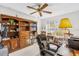 Cozy office space with custom built in bookshelves and natural lighting at 3001 Saint Thomas Ln, The Villages, FL 32162