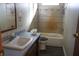 Clean bathroom with a tub, toilet and vanity at 31735 S Lake Dr, Eustis, FL 32736