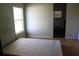 Small bedroom with a bed and window at 31735 S Lake Dr, Eustis, FL 32736