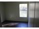 Simple bedroom with dark flooring and a window at 31735 S Lake Dr, Eustis, FL 32736