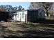 Mobile home exterior with a shed and yard at 31735 S Lake Dr, Eustis, FL 32736