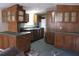 Kitchen with wood cabinets and tile floor at 31735 S Lake Dr, Eustis, FL 32736