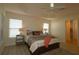 Main bedroom with ceiling fan and en-suite bathroom at 3180 Dressendorfer Dr, The Villages, FL 32163