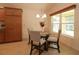 Breakfast nook features a glass table and four chairs at 3180 Dressendorfer Dr, The Villages, FL 32163