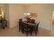 Dining area with a dark-wood table, six chairs, and a chandelier at 3180 Dressendorfer Dr, The Villages, FL 32163