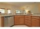 Kitchen with granite countertops and stainless steel dishwasher at 3180 Dressendorfer Dr, The Villages, FL 32163