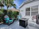 Relax on the patio with comfortable Adirondack chairs and cushions, as well as a fire table at 320 Rhapsody Path, The Villages, FL 32162