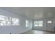 Bright and airy living room with new flooring and large windows at 324 N York St, Bushnell, FL 33513