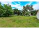 Vacant lot with mature trees and grassy area at 324 N York St, Bushnell, FL 33513