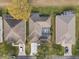 Rooftop view of single Gathering homes with screened in back porches with outdoor seating at 3637 Hawkshead Dr, Clermont, FL 34711