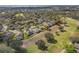 Overhead view of the property in a community with mature trees, showcasing the roof and surrounding landscaping at 3637 Hawkshead Dr, Clermont, FL 34711