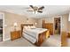 Bright bedroom featuring a double bed and wooden furniture at 37610 Quail Ridge Cir, Leesburg, FL 34788